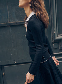 Polo anita en laine noir de côté
